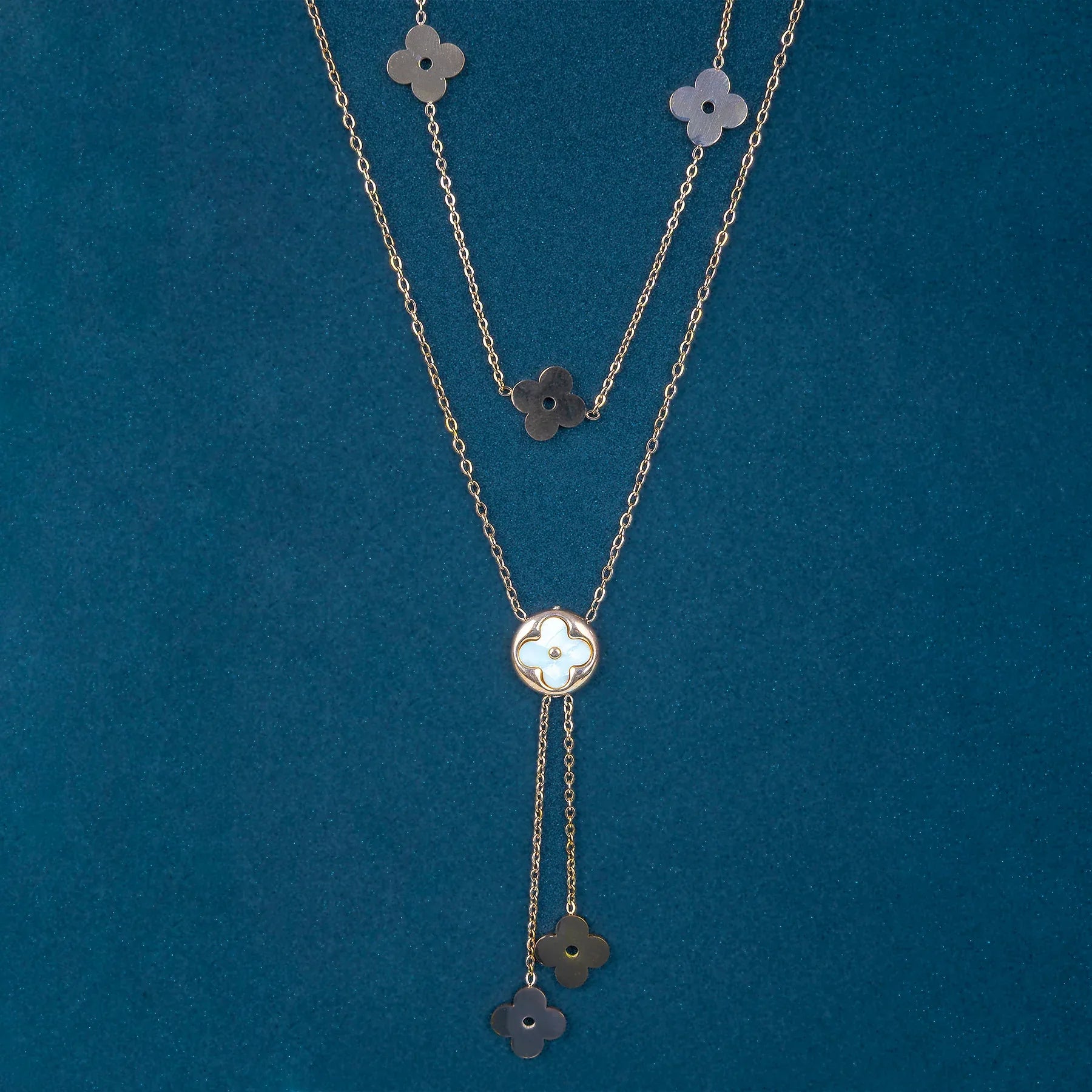 Necklace with floral pendants on a blue background