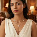 Woman wearing a necklace in a warm-toned room