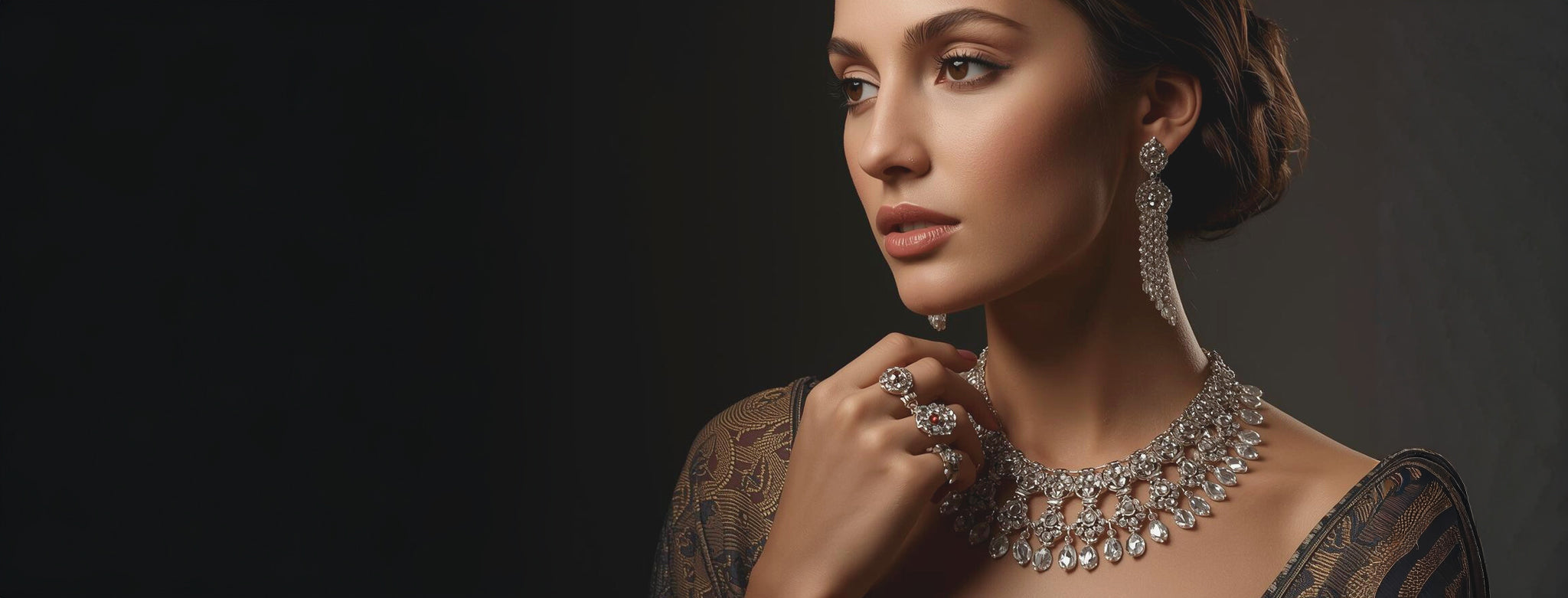 Woman wearing a luxurious diamond necklace against a dark background