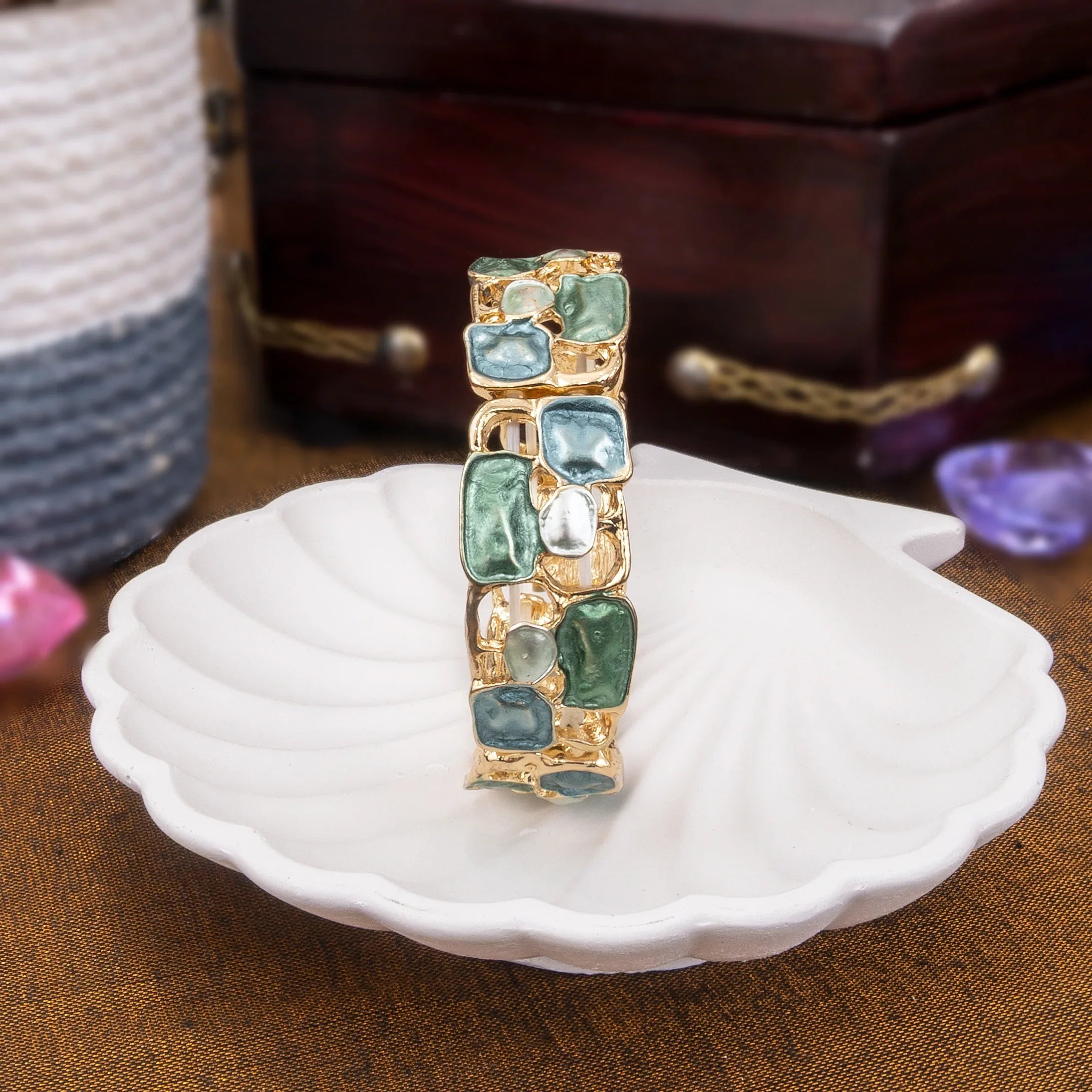 Jewelry box with gemstone accents on a white shell