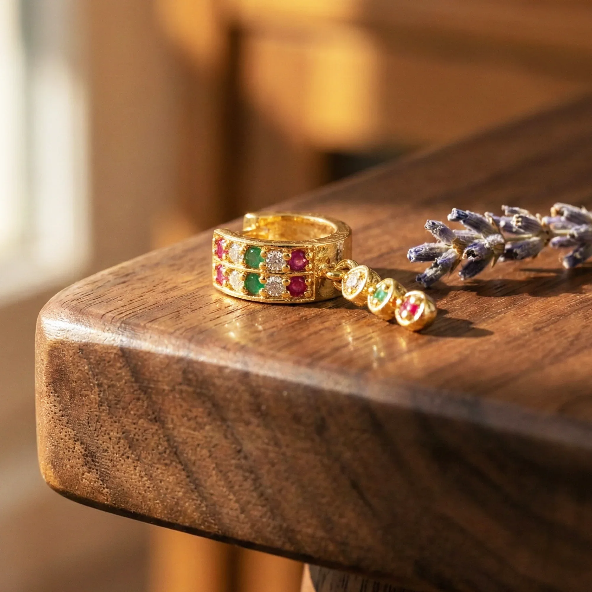 Jewelry set with rings and a bracelet on a wooden surface